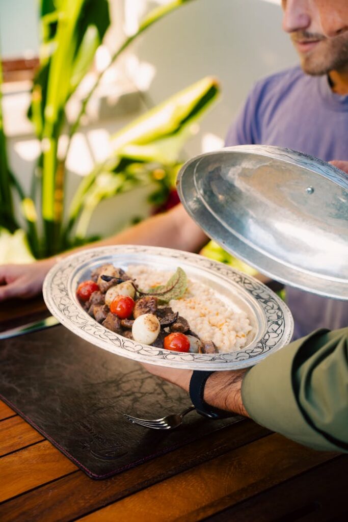 Delicious Turkish dish with meat and vegetables served outdoors in Side, Antalya.